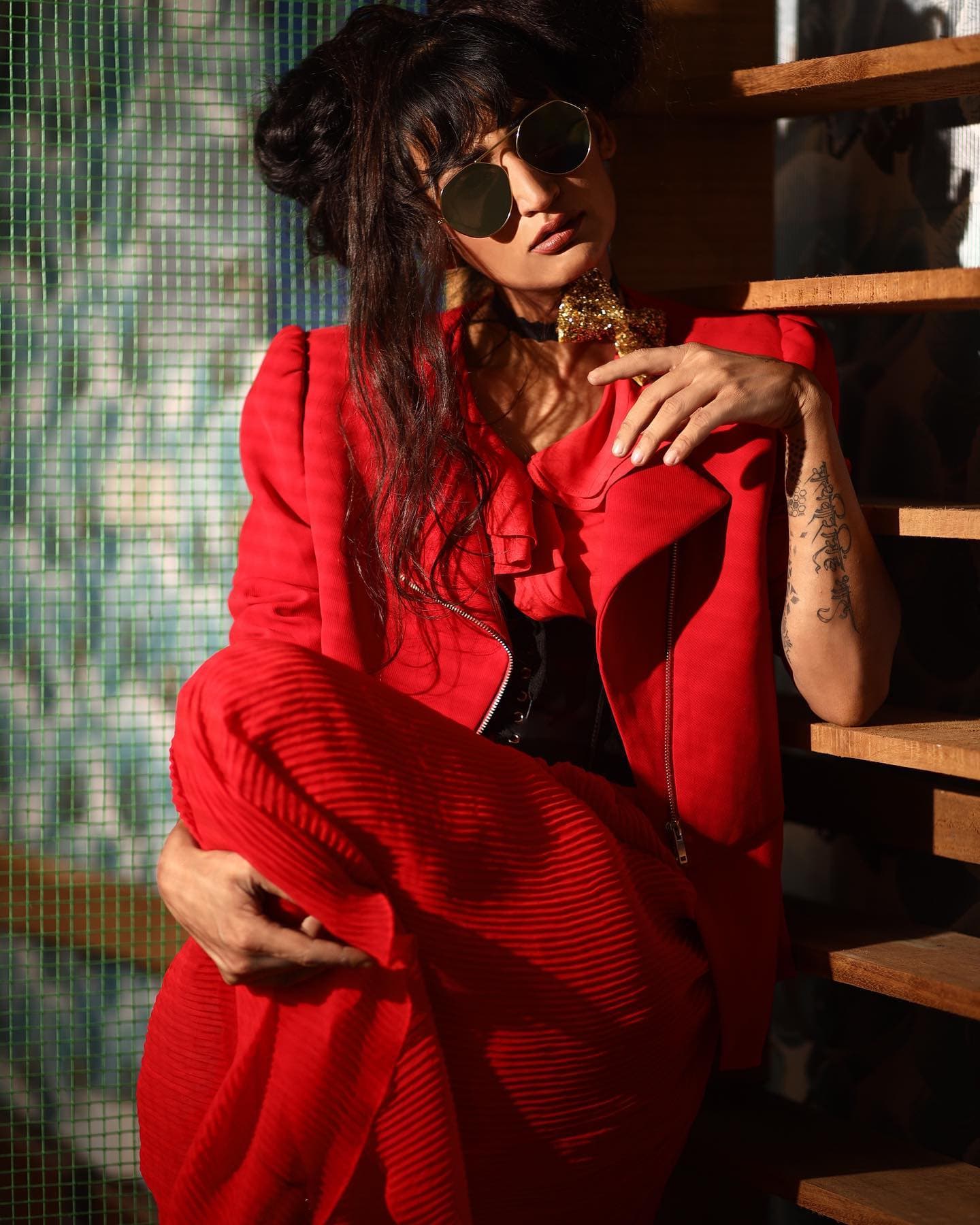 Dimpal Bhal in a red jacket and sunglasses